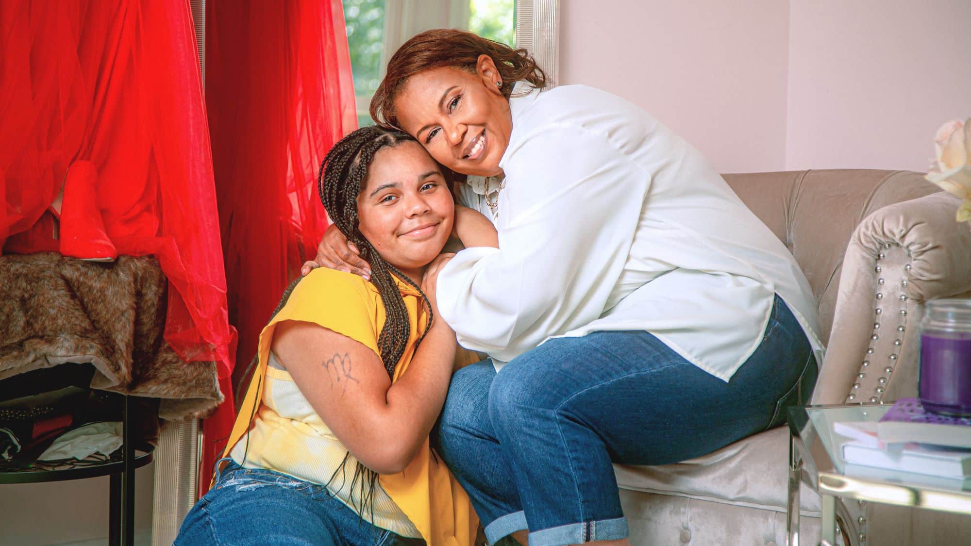 Woman embracing her child smiling