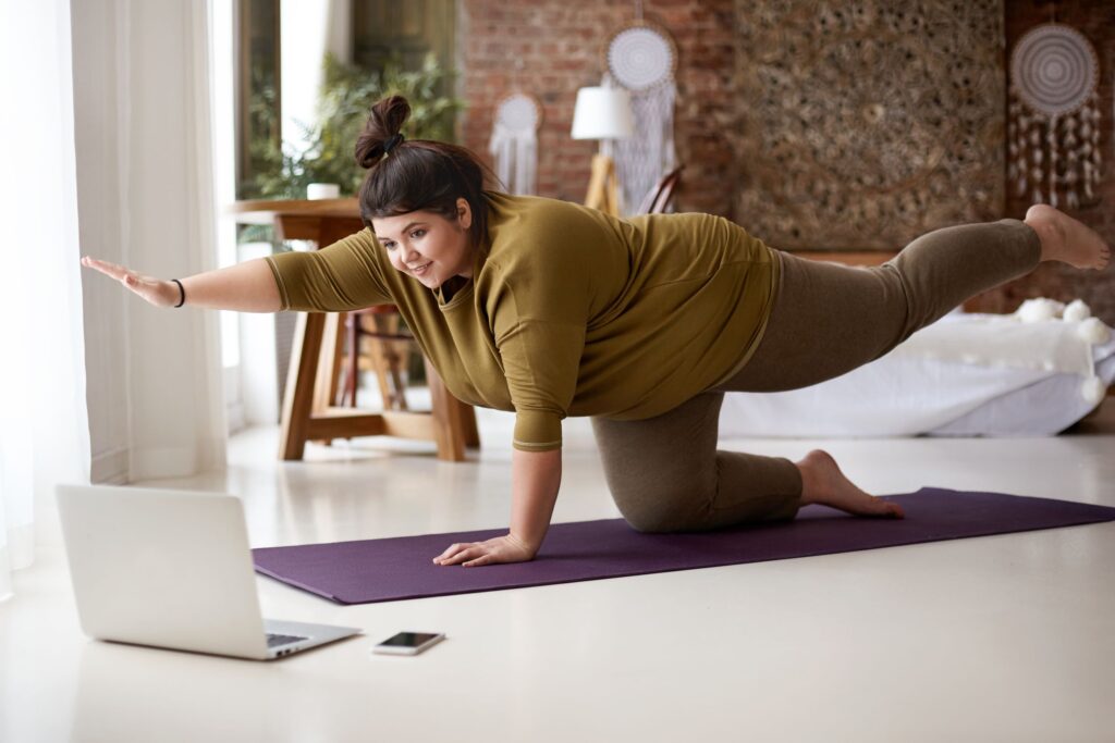 woman doing yoga from home