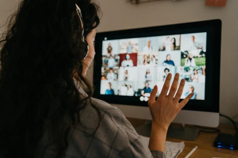 Young woman having a video call with her colleagues