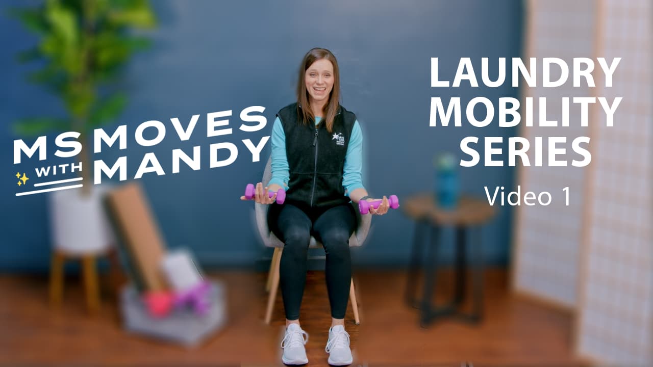 Physical therapist Mandy Rohrig sits holding dumbells