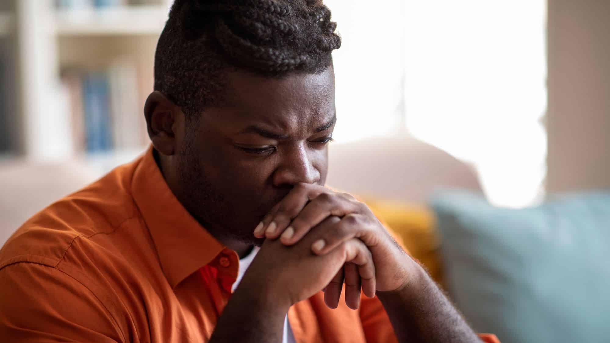 Man sitting looking depressed