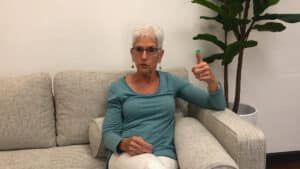 Roz Kalb sitting on a couch demonstrating red light green light fatigue signaling strategy