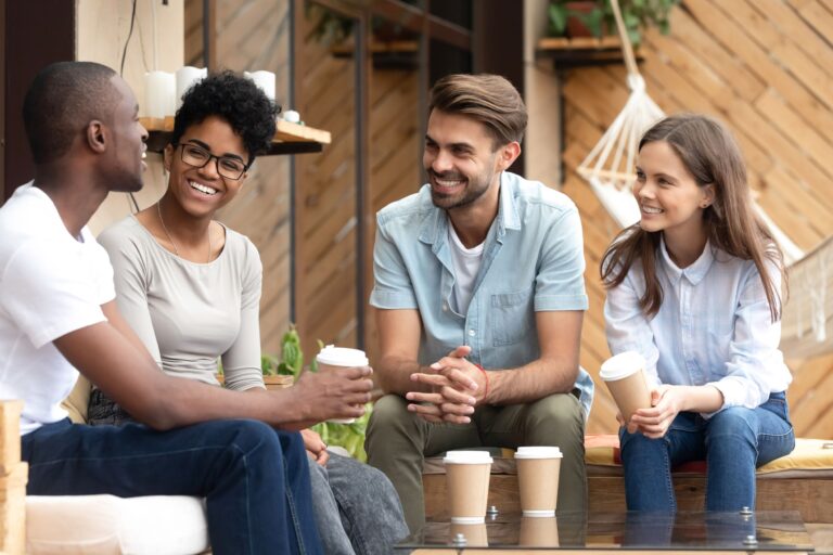 Group of adults drinking coffee together