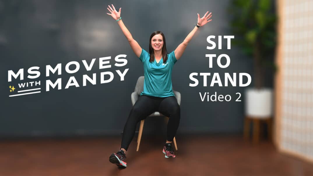 Physical therapist demonstrating seated jacks
