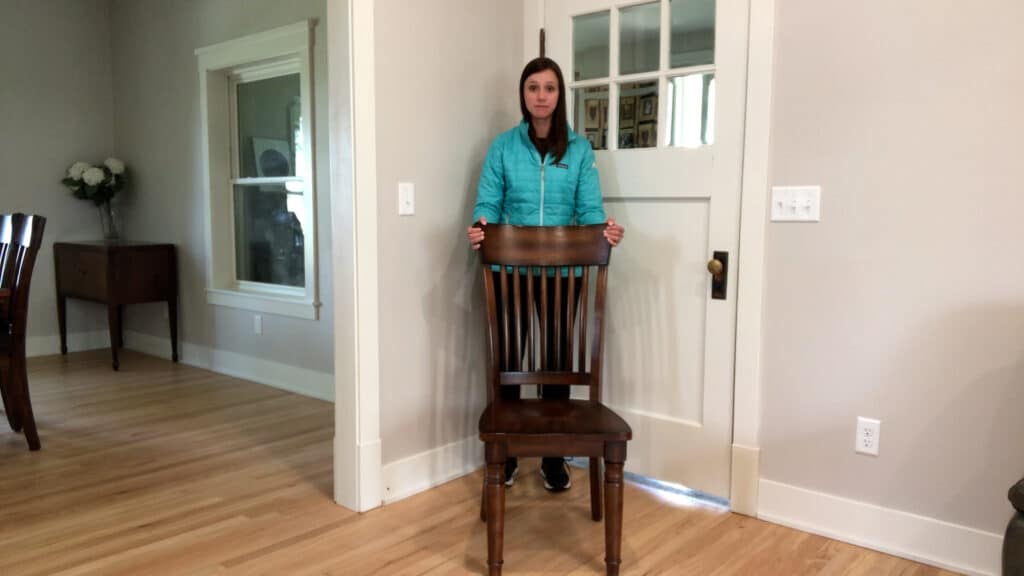Physical therapist demonstrating standing balance exercise