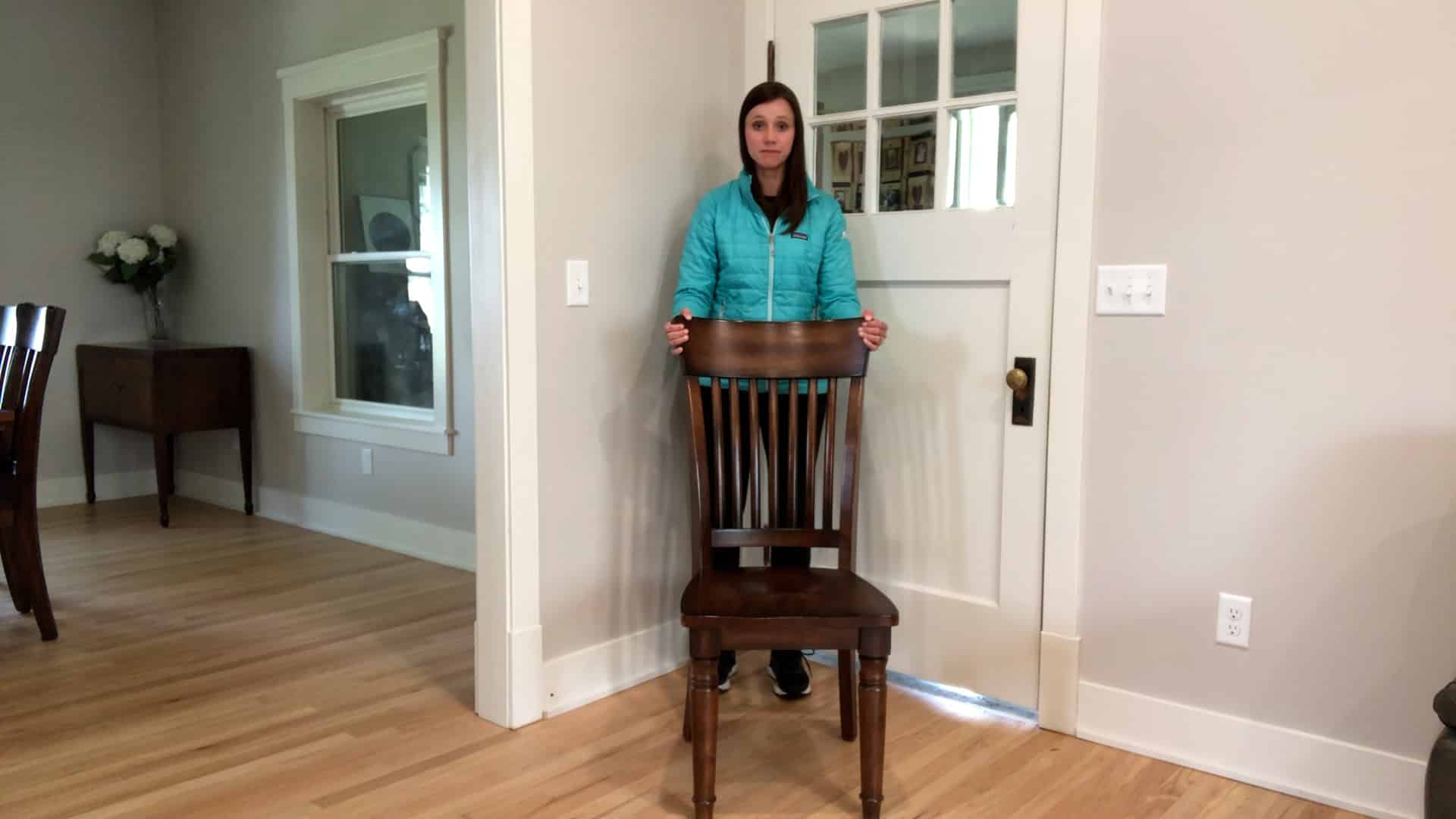 Physical therapist demonstrating standing balance exercise