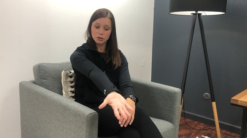 physical therapist demonstrating a stretch for wrist tightness in MS