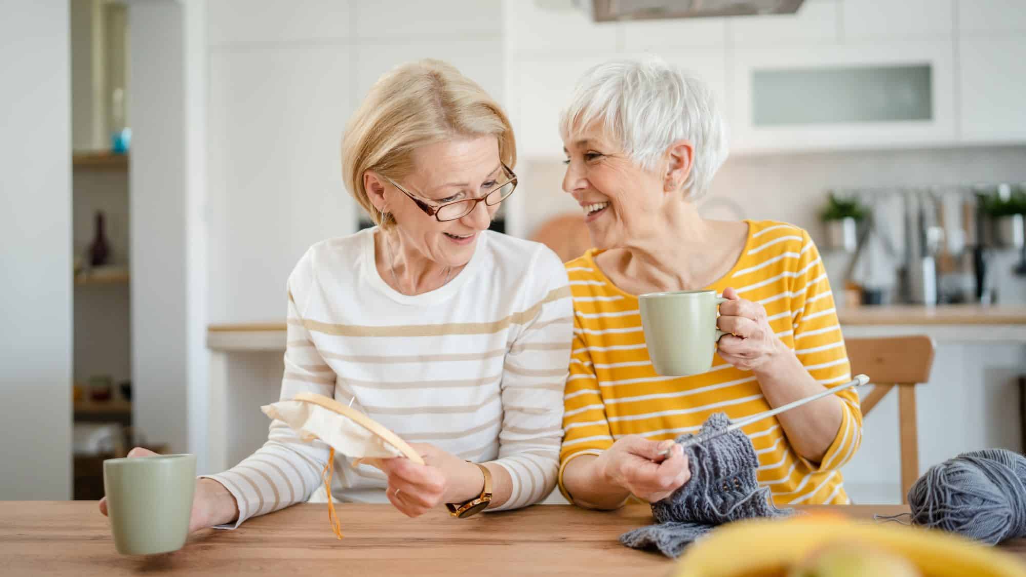 women knitting and drinking coffee together