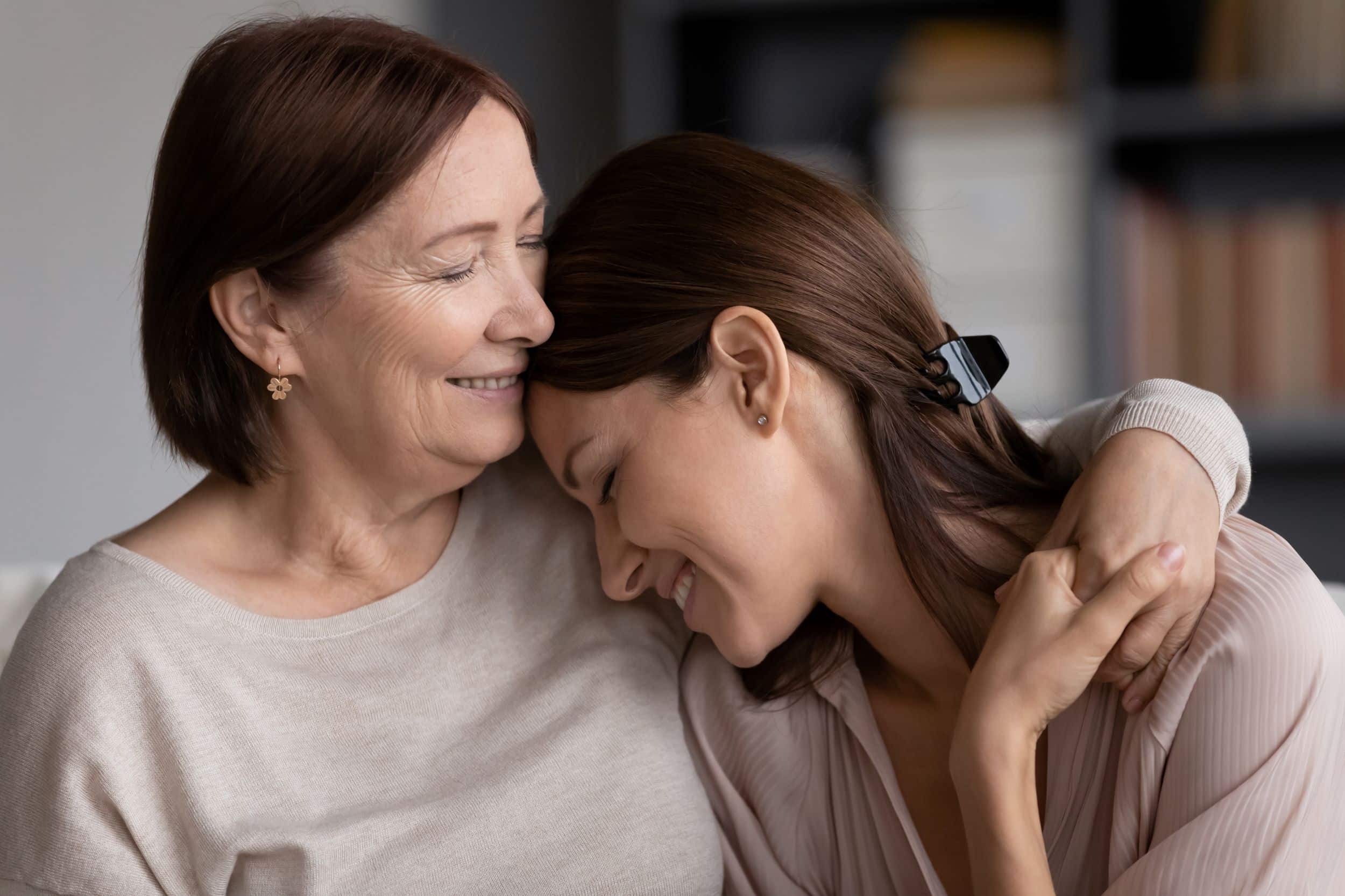 Mother and daughter embracing each other