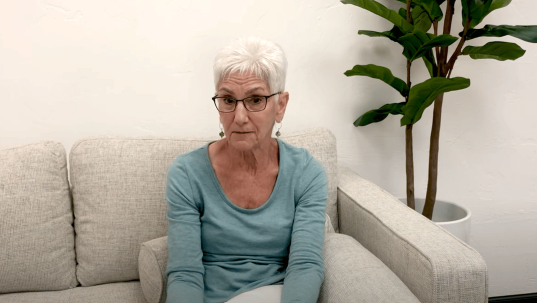 Psychologist, Roz Kalb sitting on a couch